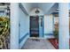 Covered entryway with arched details and a dark-colored front door at 532 Maricopa Dr, Kissimmee, FL 34758