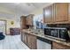 Kitchen features granite countertops, stainless steel appliances, and ample cabinetry at 532 Maricopa Dr, Kissimmee, FL 34758