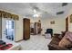 Spacious living area with access to the patio and kitchen at 532 Maricopa Dr, Kissimmee, FL 34758