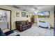 Bright living room with tiled floors and comfortable seating at 532 Maricopa Dr, Kissimmee, FL 34758