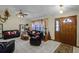 Living room with comfortable seating, a coffee table, and tiled floors at 532 Maricopa Dr, Kissimmee, FL 34758