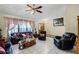 Living room with leather furniture, and a view into another room at 532 Maricopa Dr, Kissimmee, FL 34758