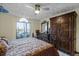 Main bedroom with walk-in closet and ceiling fan at 532 Maricopa Dr, Kissimmee, FL 34758