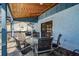 Covered patio with outdoor dining set at 532 Maricopa Dr, Kissimmee, FL 34758