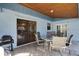 Covered patio with table and grill at 532 Maricopa Dr, Kissimmee, FL 34758