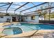 Inviting pool and spa with covered patio at 532 Maricopa Dr, Kissimmee, FL 34758