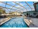 Refreshing pool and spa with screened patio at 532 Maricopa Dr, Kissimmee, FL 34758