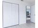 Bright bedroom with closet, light tile flooring, and white walls at 1469 Swan Pl, Kissimmee, FL 34759