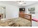 Bedroom featuring a ceiling fan, wooden furniture, and tiled flooring at 1469 Swan Pl, Kissimmee, FL 34759