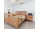 Simple bedroom with wooden furniture and tiled floor at 1469 Swan Pl, Kissimmee, FL 34759
