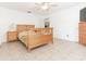 Cozy bedroom featuring tiled flooring, a ceiling fan, and large window at 1469 Swan Pl, Kissimmee, FL 34759
