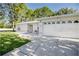 Close-up front view of a single-story home with an attached garage and driveway at 1469 Swan Pl, Kissimmee, FL 34759