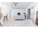 Open living room with tile floors, ceiling fan, and access to the patio at 1469 Swan Pl, Kissimmee, FL 34759