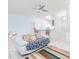 Inviting living room with white couch, colorful rug, and access to the kitchen at 1469 Swan Pl, Kissimmee, FL 34759