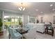 Stylish dining area adjacent to the living room, with glass doors leading to the outdoors at 1664 Andover Ridge Dr, Deland, FL 32720
