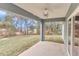 Covered back patio with ceiling fan overlooking a grassy yard at 199 Juniper Way, Ocala, FL 34472