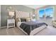 Elegant Primary bedroom with tufted headboard, stylish decor, and large windows at 2105 Pigeon Plum Dr, Haines City, FL 33844
