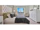 Bright and airy Primary bedroom with large windows and a comfortable bed at 2105 Pigeon Plum Dr, Haines City, FL 33844