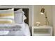 Modern bedroom with stylish wooden headboard, gold lamp, and striped pillows at 2105 Pigeon Plum Dr, Haines City, FL 33844