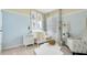 Charming Bedroom decorated in light blue and white with a crib and a comfortable armchair at 2105 Pigeon Plum Dr, Haines City, FL 33844
