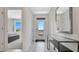 Bright foyer with white tile floor, entryway table, and view to bedroom at 2105 Pigeon Plum Dr, Haines City, FL 33844
