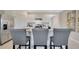 Stylish kitchen with white cabinets, an island, and stainless steel appliances at 2105 Pigeon Plum Dr, Haines City, FL 33844