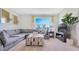 Spacious living area with plush sectional sofa, perfect for relaxation and entertainment at 2105 Pigeon Plum Dr, Haines City, FL 33844