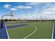 Community basketball court with multiple hoops and lights for evening games at 2765 Flushing Dr, Apopka, FL 32703