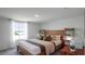 Bright and cozy bedroom with wood bed frame and window with natural light at 2765 Flushing Dr, Apopka, FL 32703