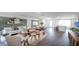 Inviting living room with comfortable white sofa, wood accents, and sliding glass doors leading to patio at 2765 Flushing Dr, Apopka, FL 32703