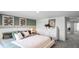 Main bedroom with a comfortable bed, dresser, and ensuite bathroom access at 2765 Flushing Dr, Apopka, FL 32703
