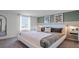 Large main bedroom with white bed and green accent wall at 2765 Flushing Dr, Apopka, FL 32703