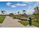 Community playground with slide, benches, and water fountain at 2765 Flushing Dr, Apopka, FL 32703