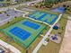 Community tennis courts, basketball court, playground, and parking lot at 2765 Flushing Dr, Apopka, FL 32703