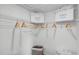 Spacious walk-in closet with wire shelving and wooden hangers at 2765 Flushing Dr, Apopka, FL 32703