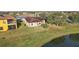 Aerial view showcasing backyard, patio, and waterfront location at 2920 Orangebud Dr, Kissimmee, FL 34746