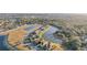 An aerial view of homes in a community with a winding street alongside a lake at 2920 Orangebud Dr, Kissimmee, FL 34746