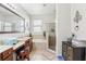 Spacious main bathroom with double sinks, a separate tub, and a walk-in shower at 2920 Orangebud Dr, Kissimmee, FL 34746