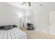 Cozy bedroom featuring a bed, desk area, and ceiling fan at 2920 Orangebud Dr, Kissimmee, FL 34746