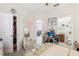Bedroom with bed, closet, desk, and attached bathroom at 2920 Orangebud Dr, Kissimmee, FL 34746
