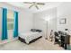 Bedroom with ceiling fan, bed, desk, and musical instrument at 2920 Orangebud Dr, Kissimmee, FL 34746
