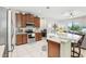 Eat-in kitchen with plenty of counter and cabinet space and a view of the living room area at 2920 Orangebud Dr, Kissimmee, FL 34746