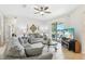 Living area with couches, entertainment center, and sliding glass doors leading to the patio at 2920 Orangebud Dr, Kissimmee, FL 34746