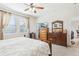 Main bedroom with wooden dresser, walk-in closet, and ensuite bathroom at 2920 Orangebud Dr, Kissimmee, FL 34746