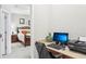 Home office space with a view of the main bedroom at 2920 Orangebud Dr, Kissimmee, FL 34746