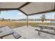 Covered picnic area in a park with tables and a tranquil view of a lake and homes at 2920 Orangebud Dr, Kissimmee, FL 34746