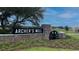 Stone and wood sign at the entrance to Archer's Mill at 3243 Arch Ave, Ormond Beach, FL 32174