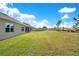 Large backyard with green lawn and trees at 344 American Holly Ave, Debary, FL 32713