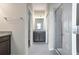 Bathroom with a walk-in shower, dual vanities, and granite countertops at 4148 Lavender Ct, Lake Hamilton, FL 33851