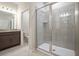 Modern bathroom with a walk-in shower, tiled walls, and granite countertop vanity at 4148 Lavender Ct, Lake Hamilton, FL 33851